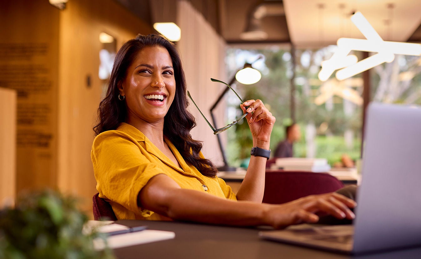 Businesswoman working on laptop.