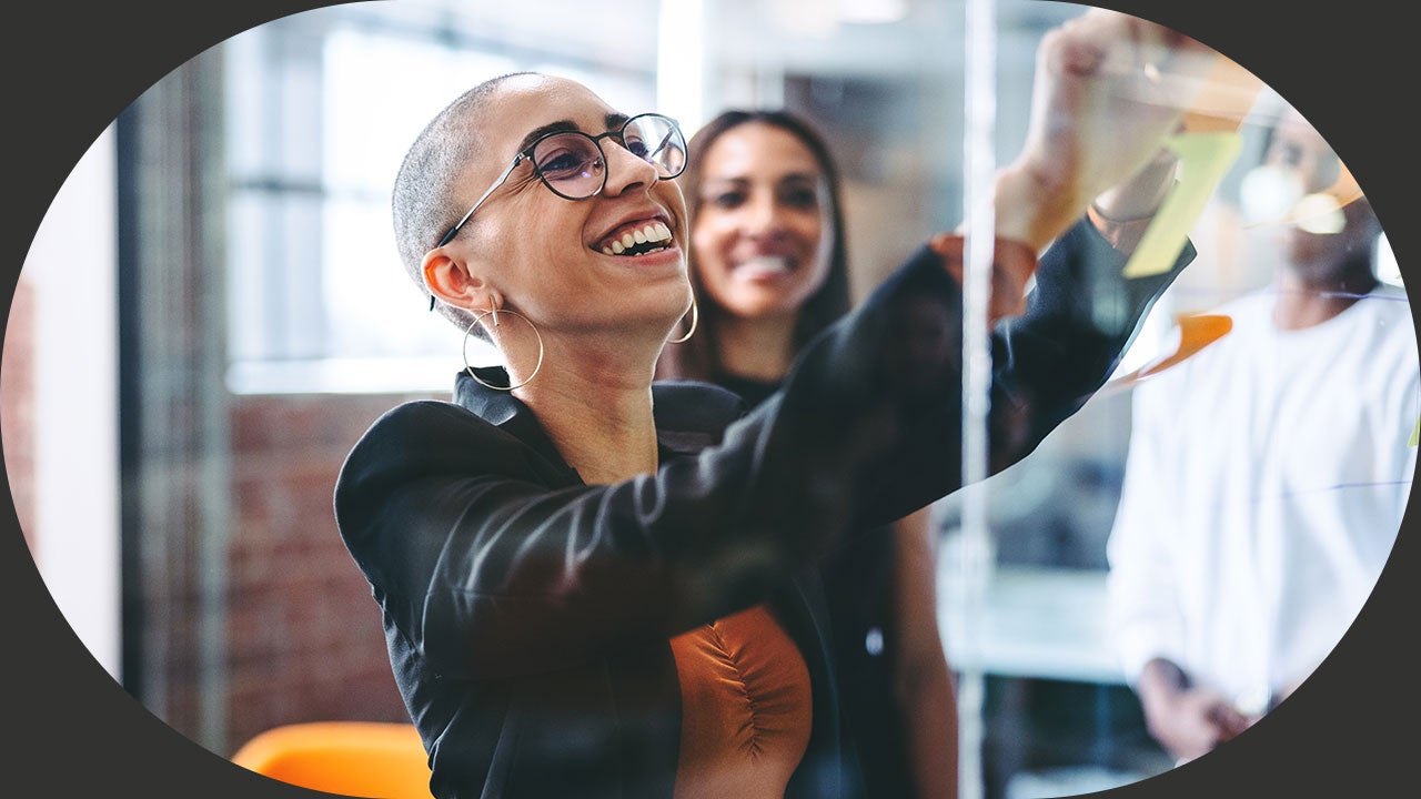 Smiling businesswoman sharing her ideas with her colleagues.