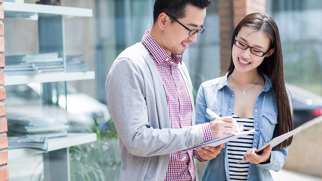 Collegues taking notes.