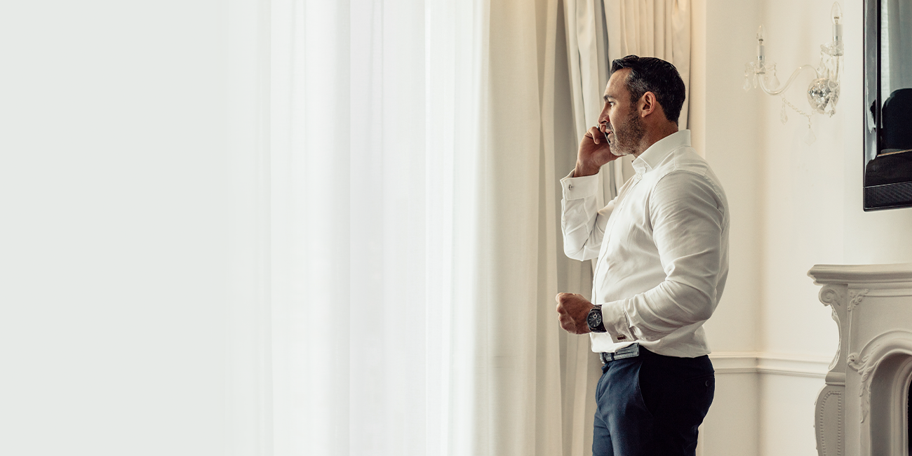 man looking at the window
