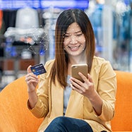Woman using face recognition on phone.