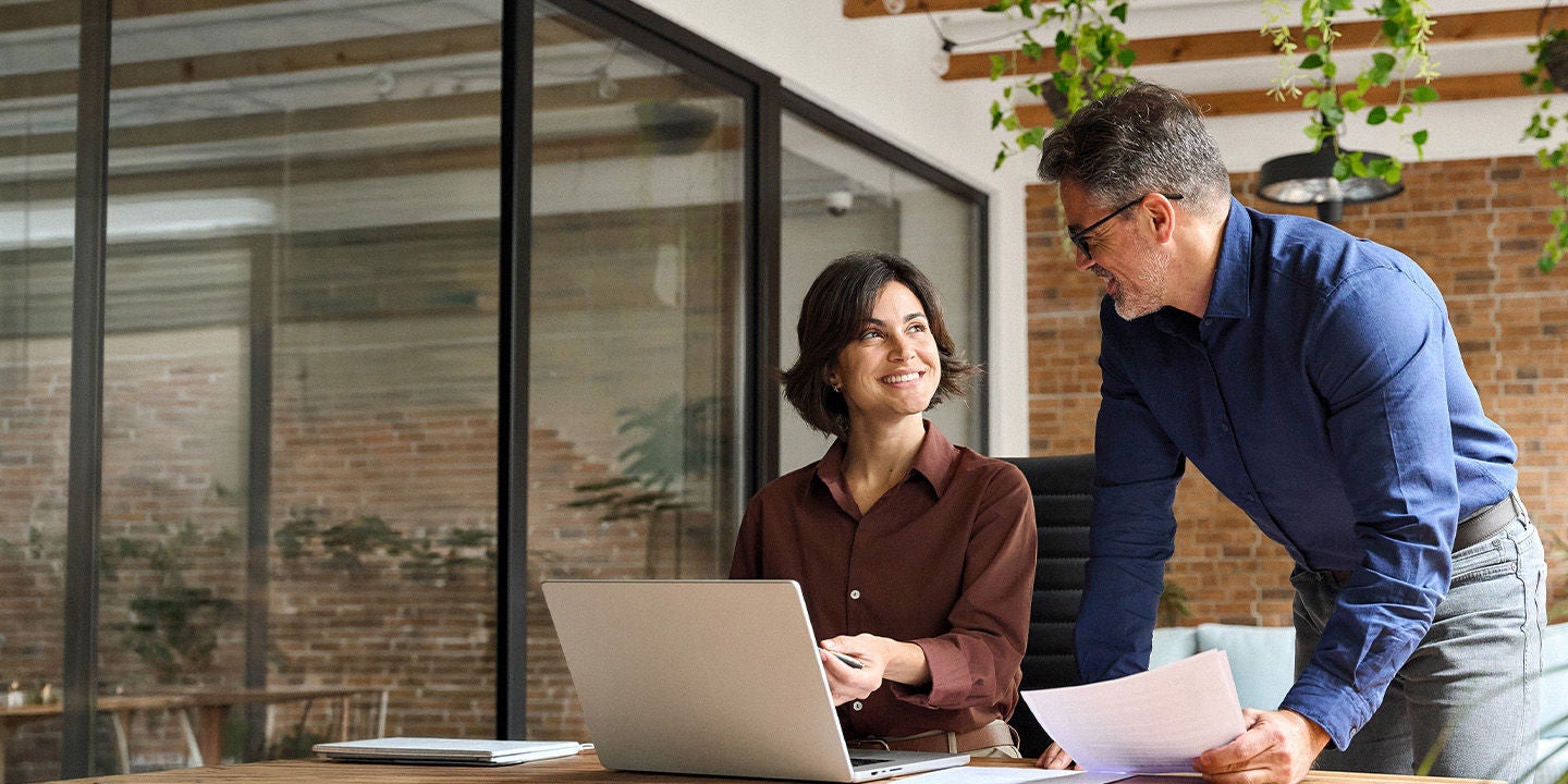 Man and woman working together at the office