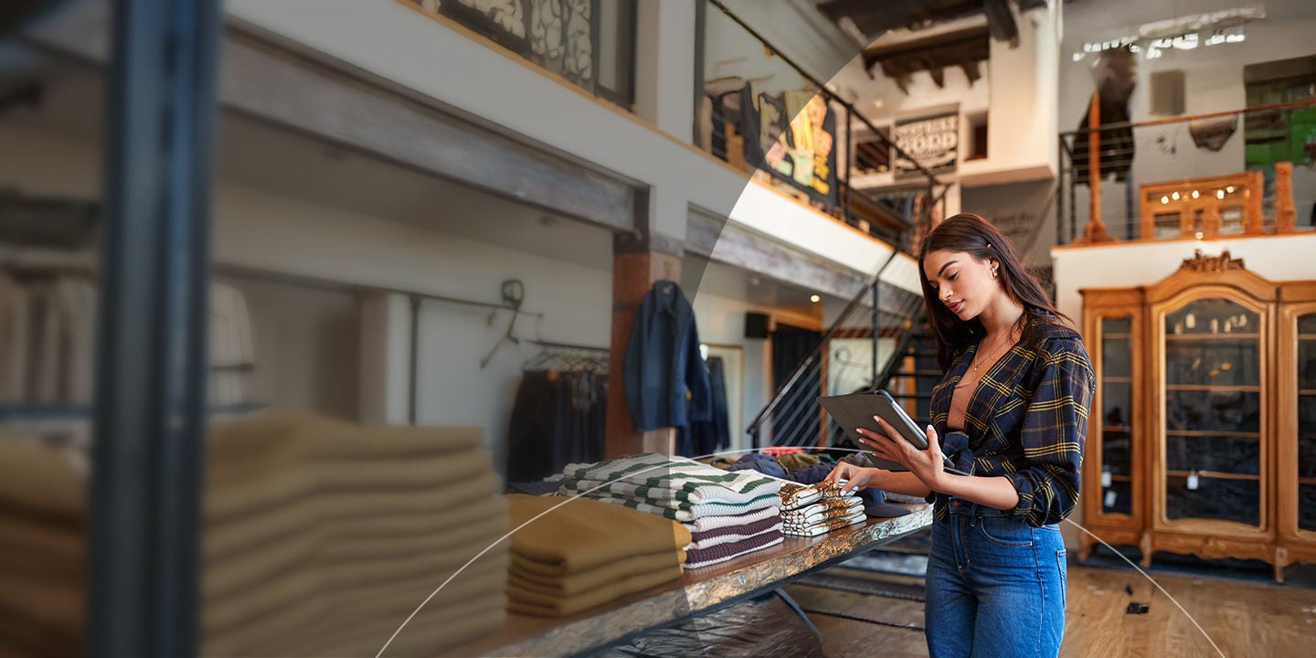 Young employee conducting inventory in a retail store. 