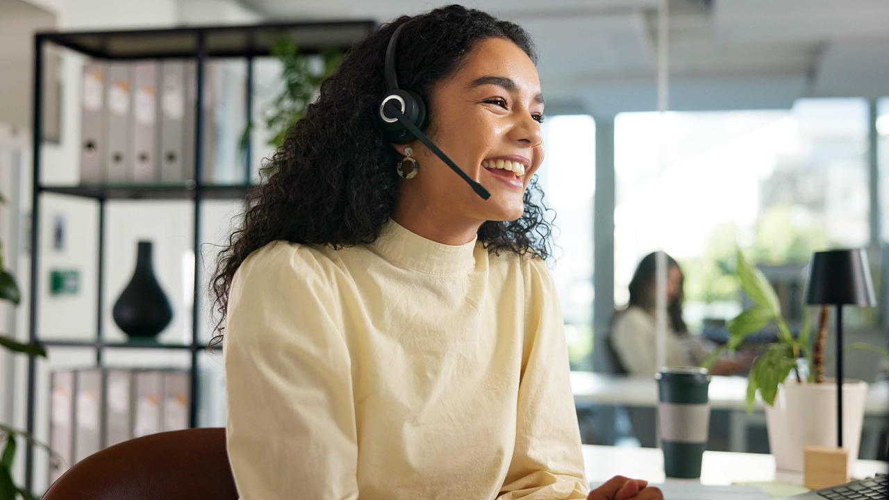 Woman wearing headset and smiling