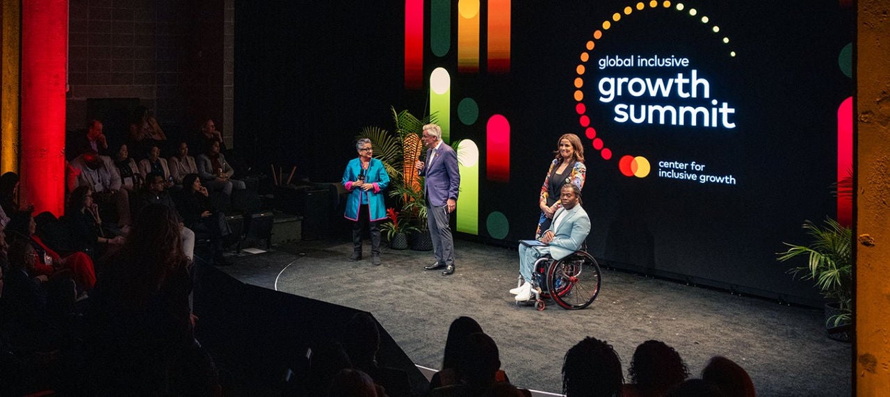 Shamina Singh, Jon Huntsman, Andrea Veiera and Ade Adepitan on stage at the Global Inclusive Growth Summit. 