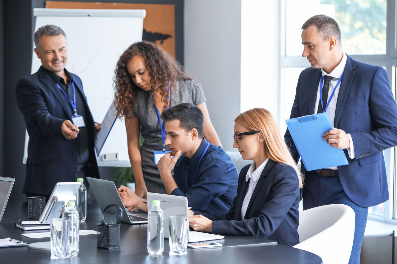Team of business people during meeting in office.