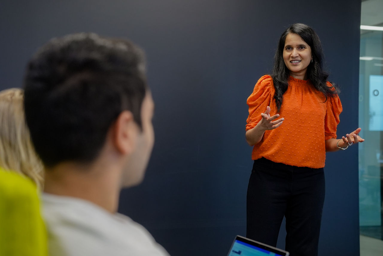 Woman presenting to group of people