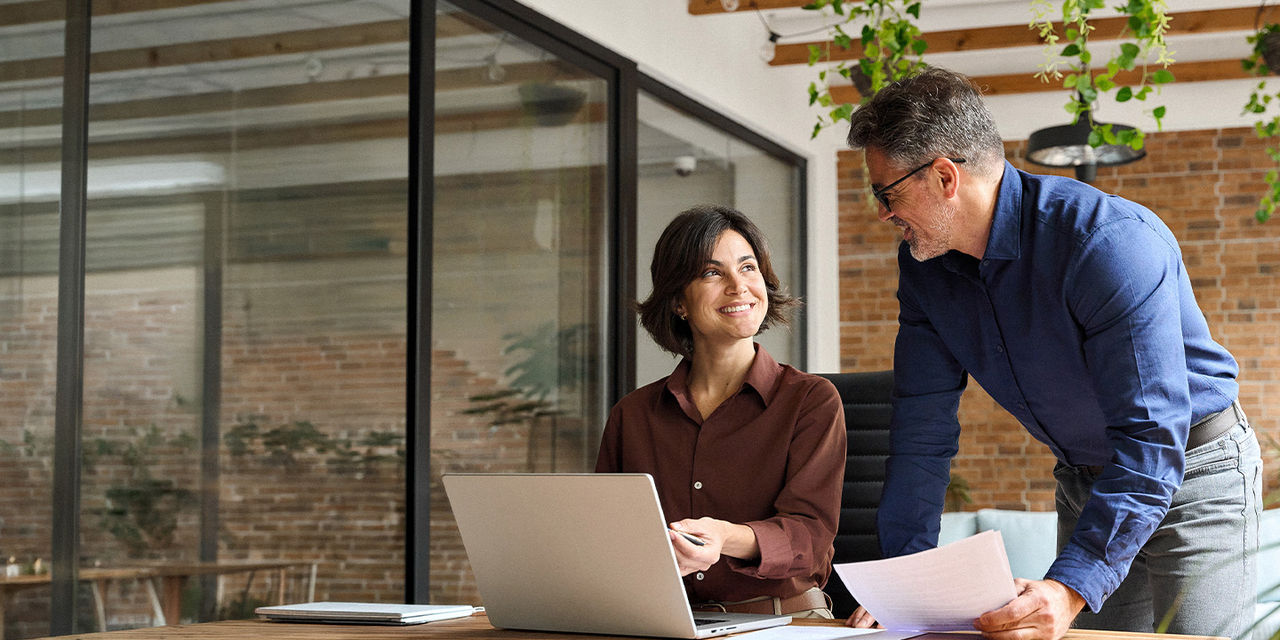 Man and woman working together at the office