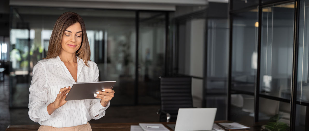 Woman using tablet device.