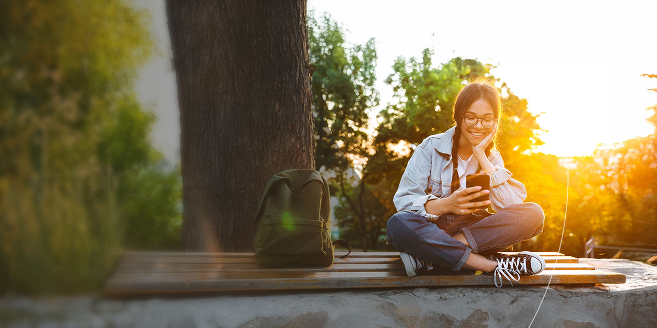 Happy young student wearing eyeglasses.