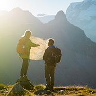 Two mountain climbers looking at a map.