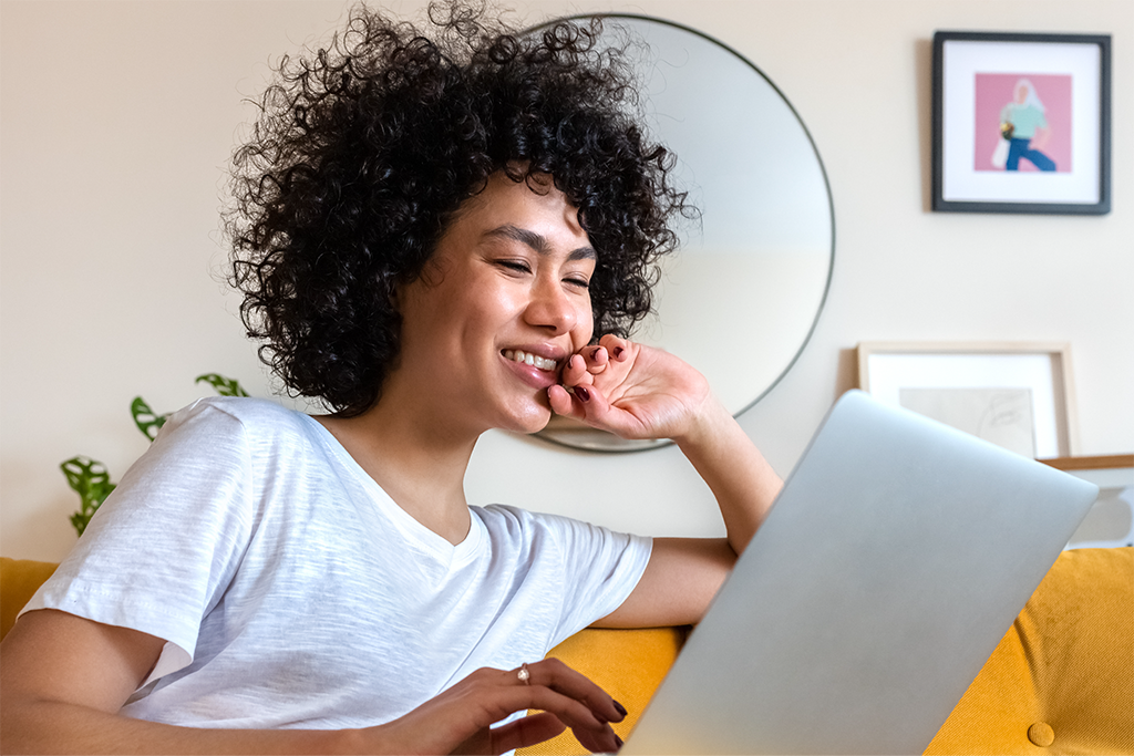 Woman using her computer at home