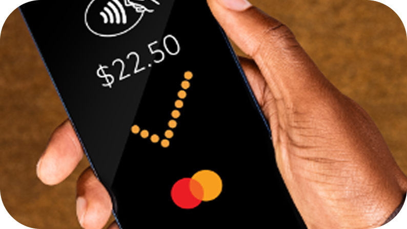 Image depicting the process of using a credit card on a mobile device for transactions.