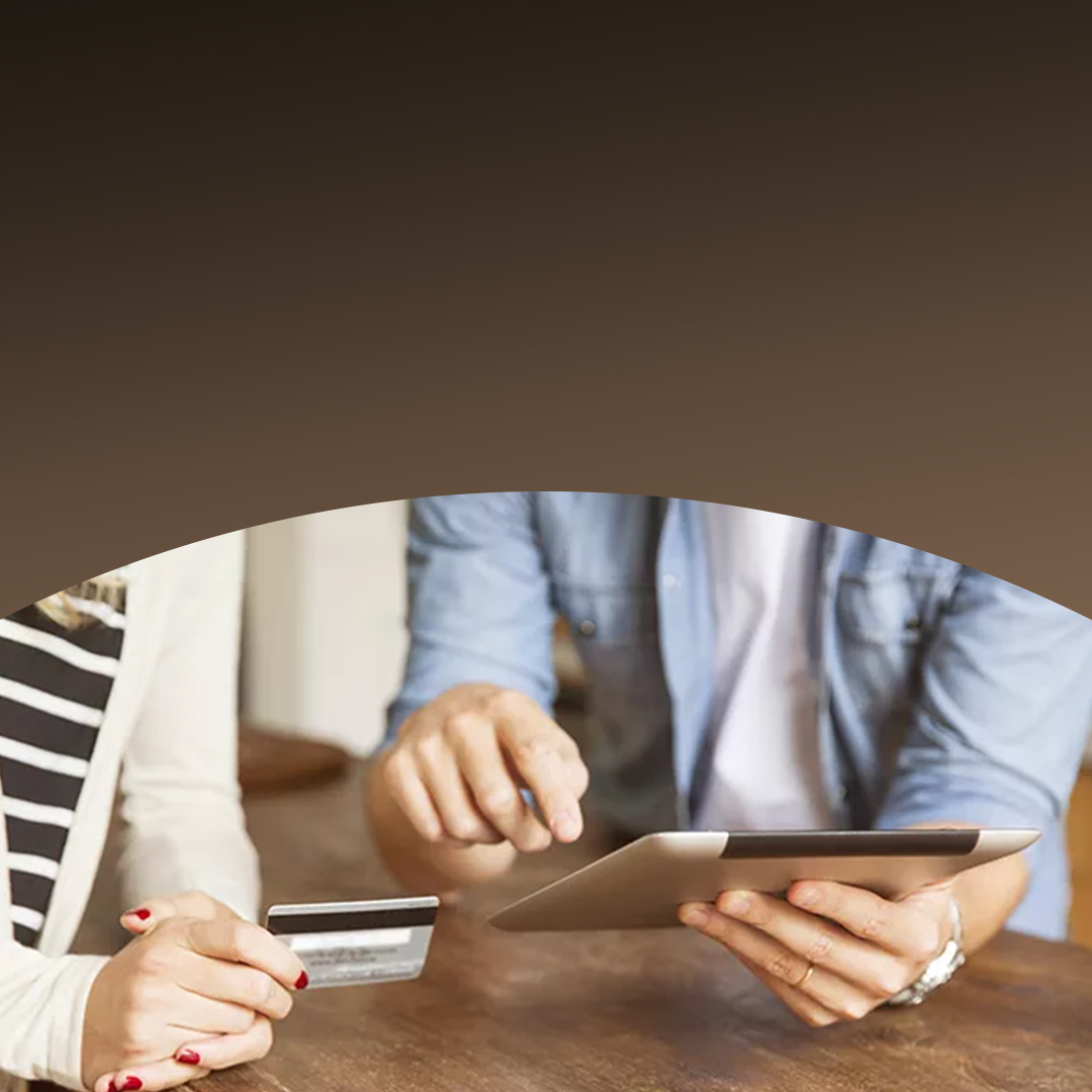 Man and woman making an online payment with a tablet.
