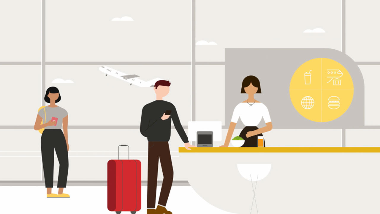 Un groupe de personnes au comptoir d'un aéroport s'enregistrant pour leur vol.