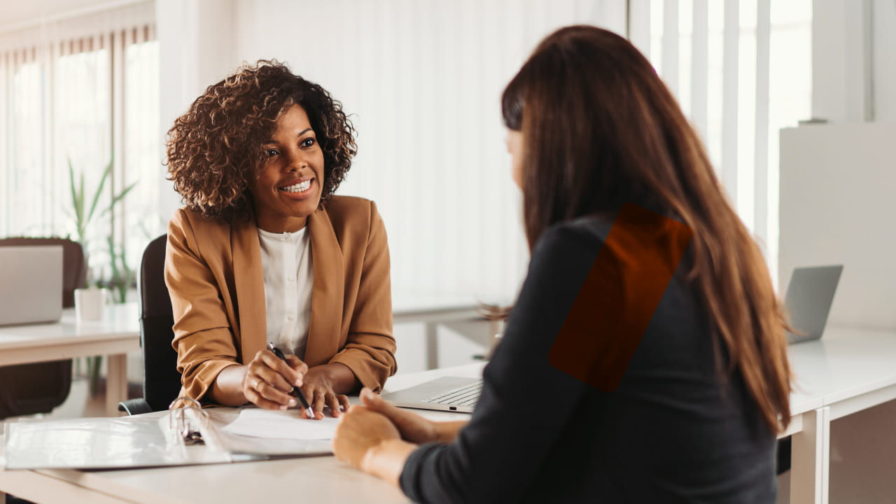 two women discussing plans