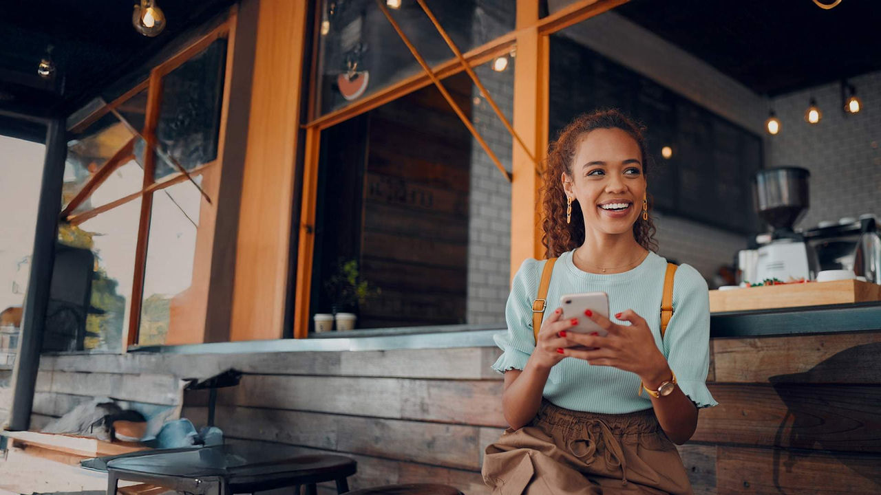 Phone, social media and coffee shop with a woman