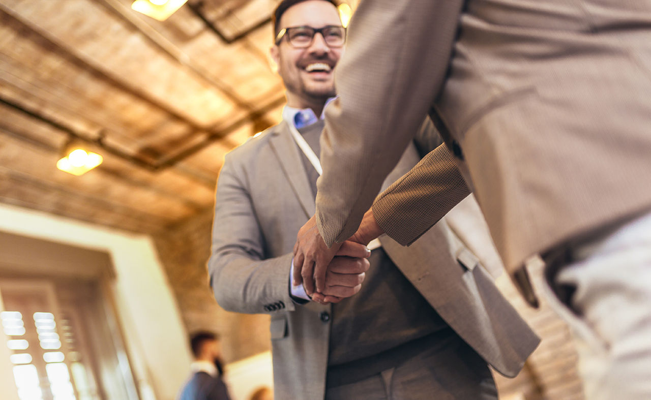 Two men shaking hands.
