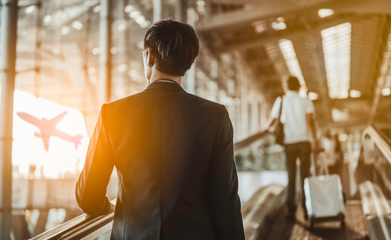 Businessman moving to terminal gate.