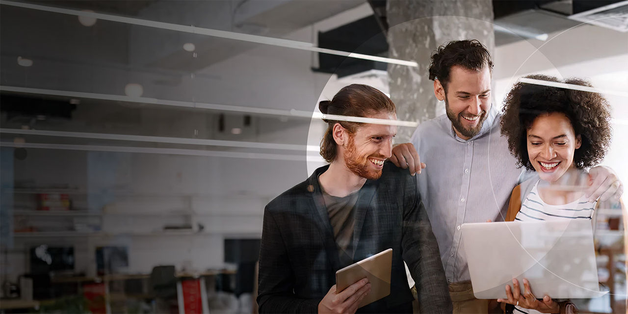 Three happy employees working together