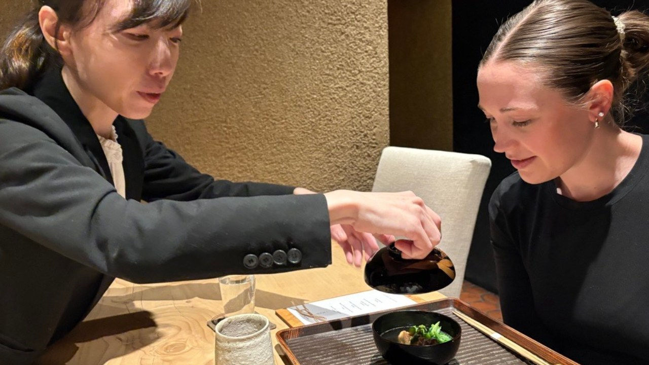 A guest is presented with soup brimming with sea bream, scallions, asparagus and maitake mushrooms and topped with aromatic yuzu. 