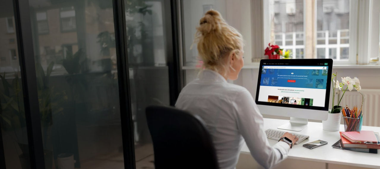blonde woman working on a computer