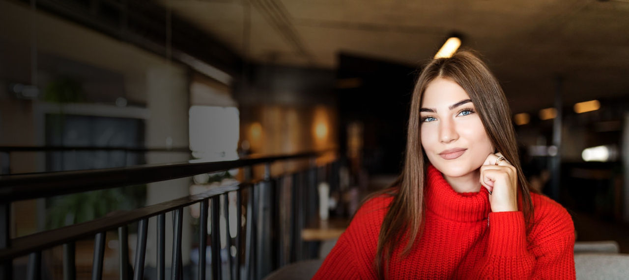 young woman in red sweater