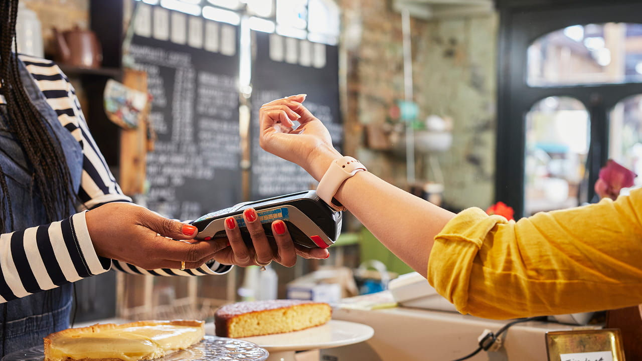 close up of smartwatch payment transaction