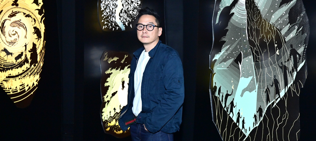 “The fires created radical moments of awareness for the need for climate action," says Glenn Kaino, above, among illustrations by Ukrainian artist Kirill Yeretsky. 