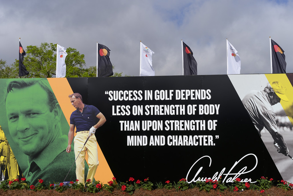 A billboard at the Arnold Palmer Invitational that shows vintage photos of Arnold Palmer. 
