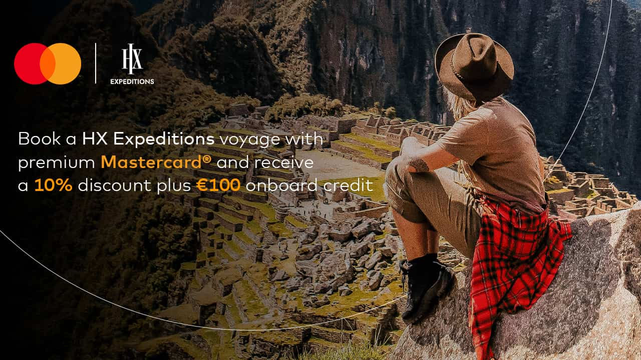 woman sitting overlooking machu picchu