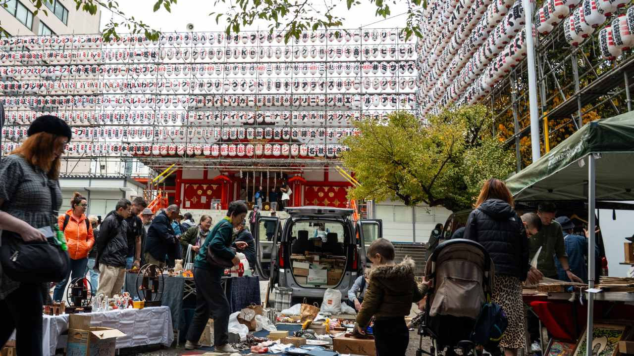 People shop at a flea market in Japan. 