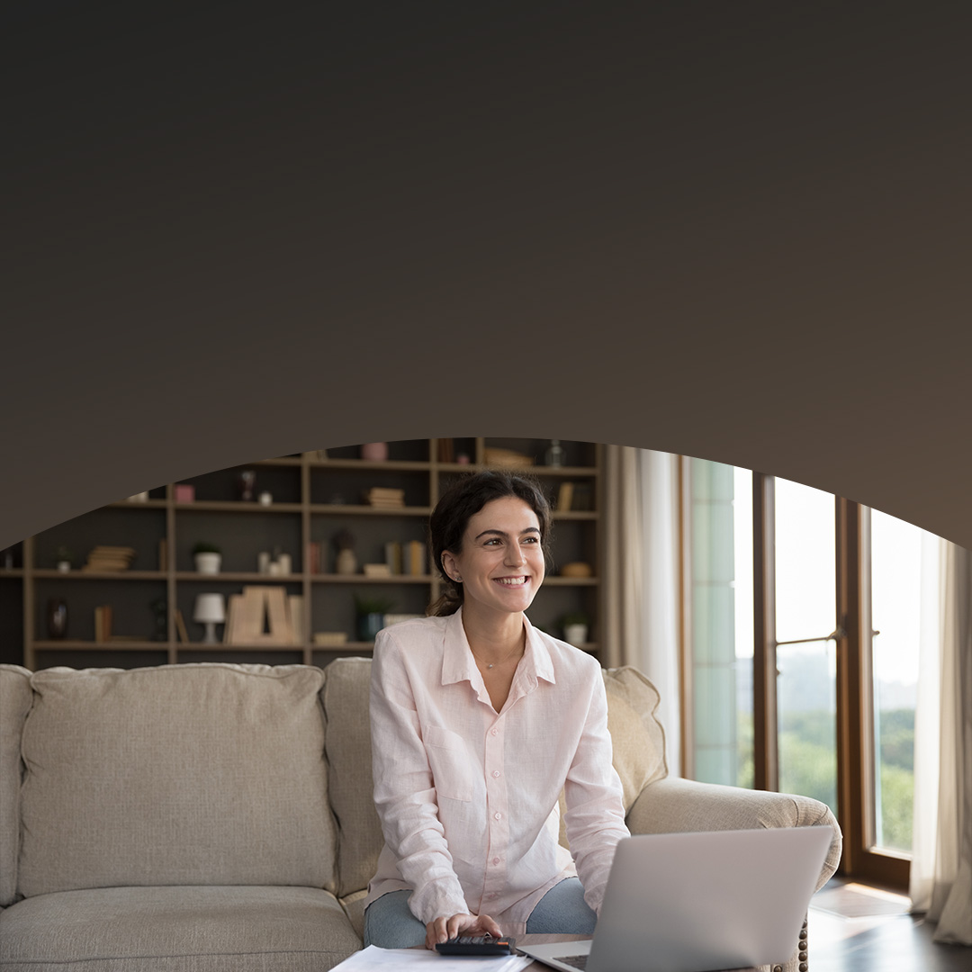 Young content homeowner using laptop.
