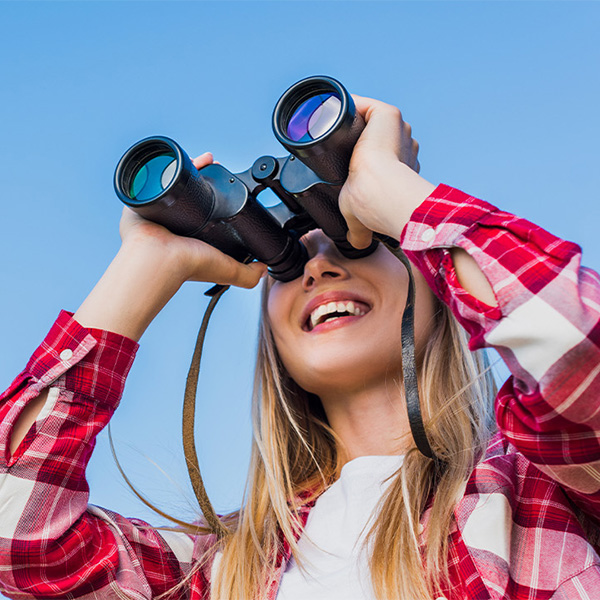 Woman using binoculars