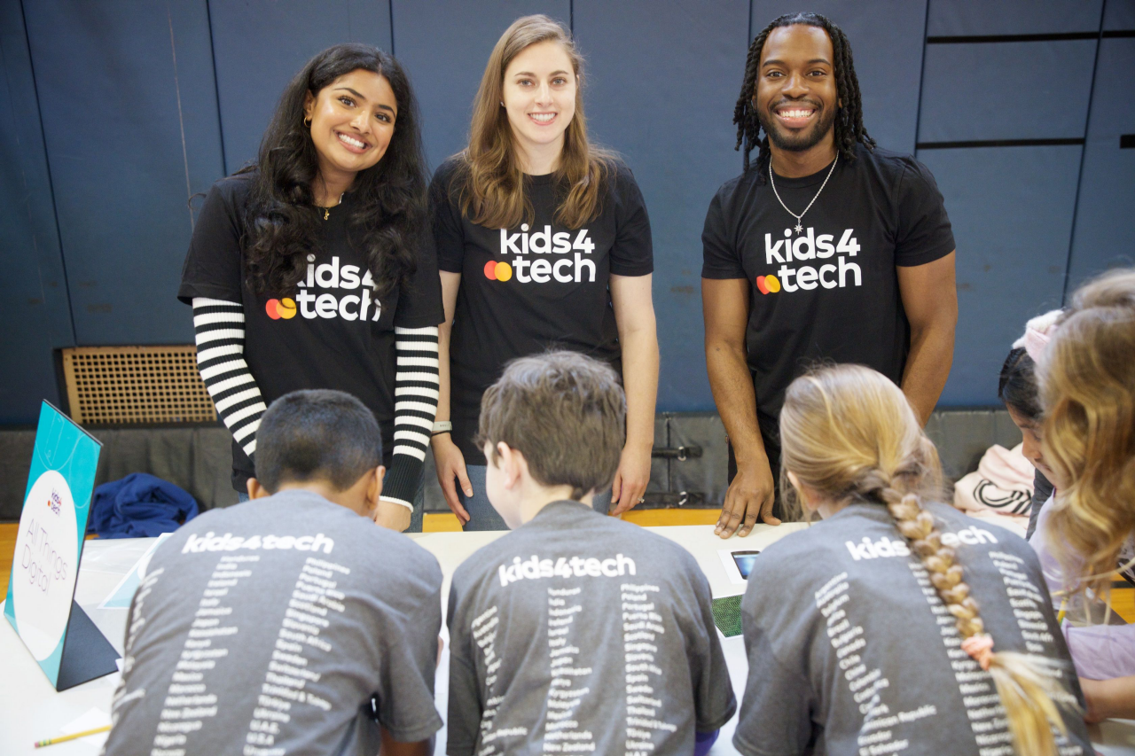 Three people teaching kids.