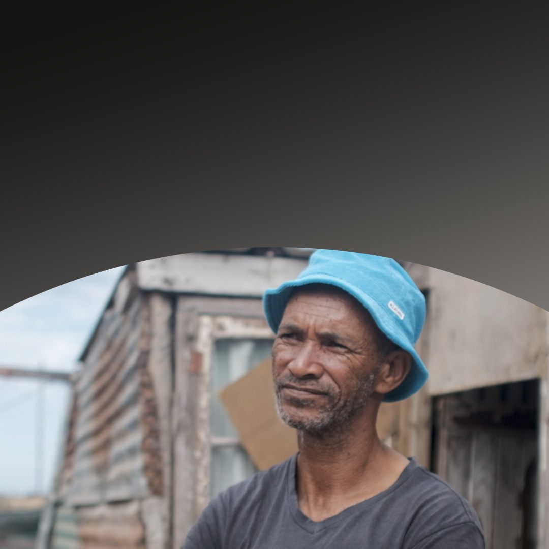 Man wearing hat looking off into the distance