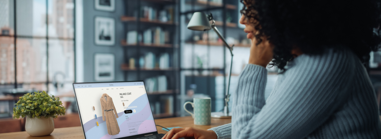 A woman shops online at home. 