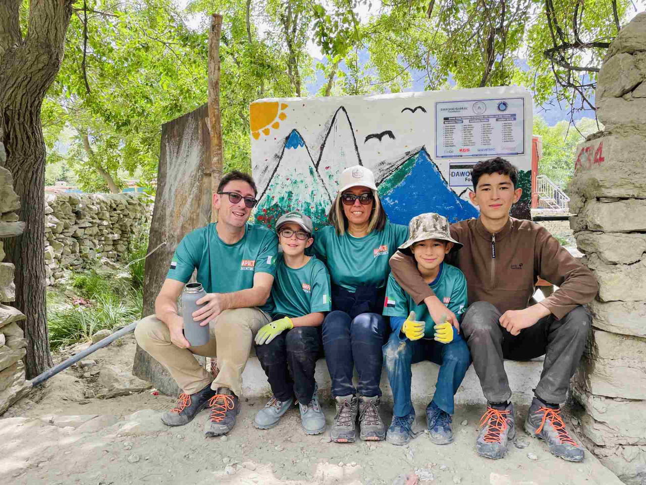 Kuntay Simbatova and her family sit at the edge of a well. 