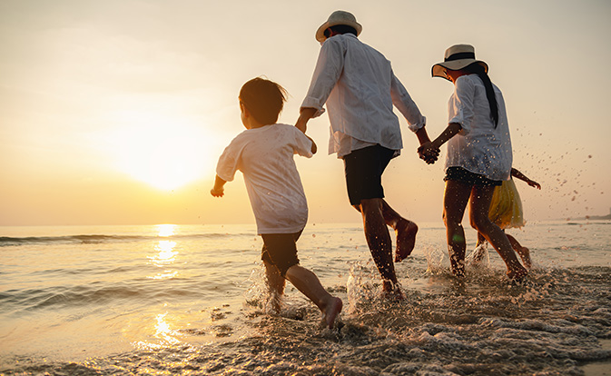 Happy family at sunset.
