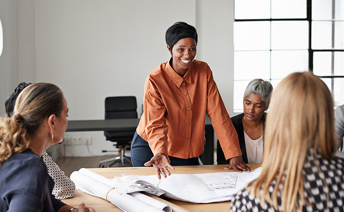 mentor leads a meeting.