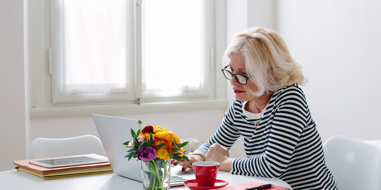 Woman using her computer at home