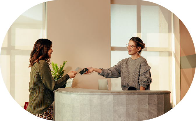 Two women doing a card payment