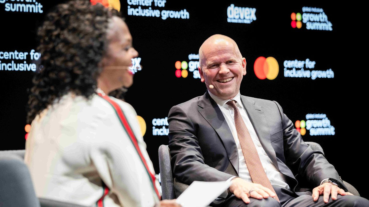 Michael Miebach and Alissa "Dr. Jay" Abdullah are seated on the GIGS stage and laughing. 