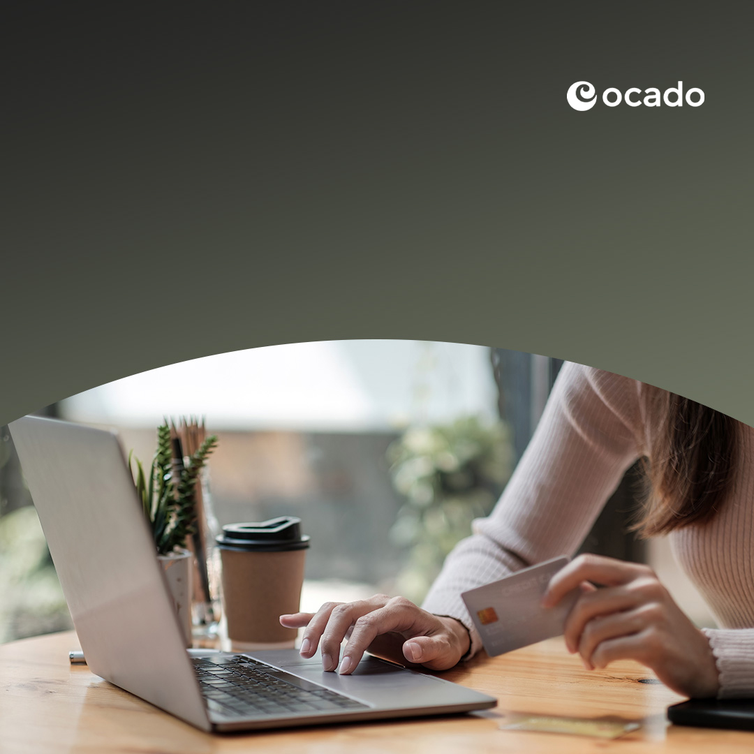 Woman holding bank credit card shopping online.