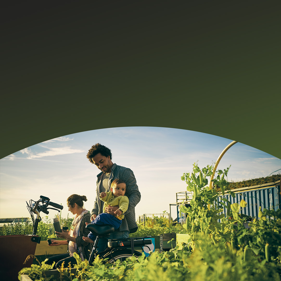 Man working on a farm with his family. 