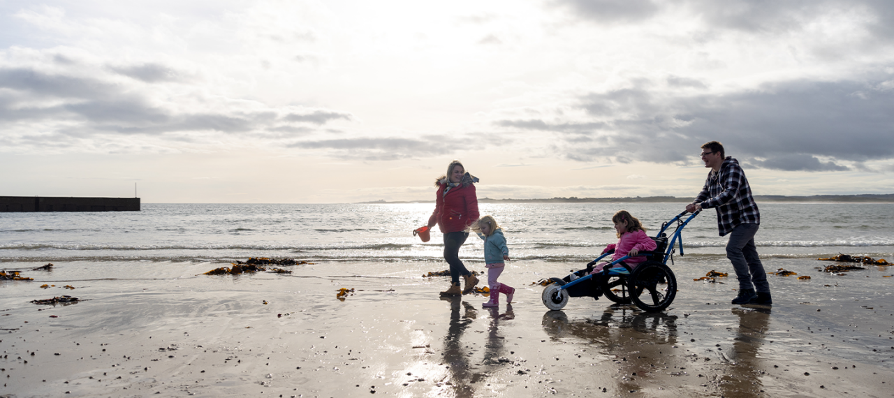 Family playing at the beach