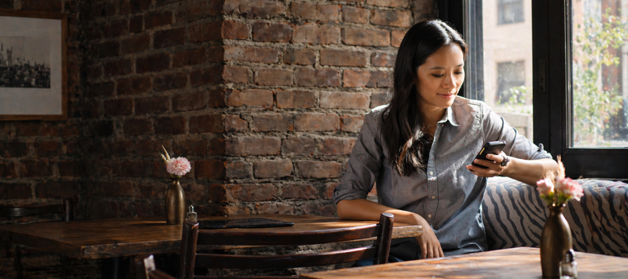 Woman use phone in coffee shop