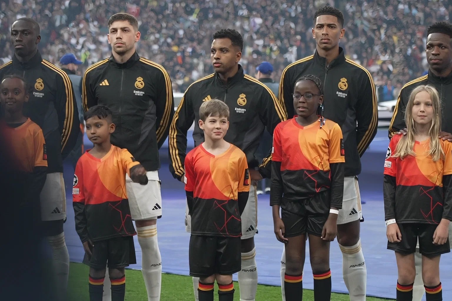 Nine-year-old Luke Maguire (centre) not only revelled in the rare chance of accompanying Brazilian footballer Rodrygo Silva de Goes to the field but he also met other Real Madrid icons like English midfielder Jude Bellingham (second from right).