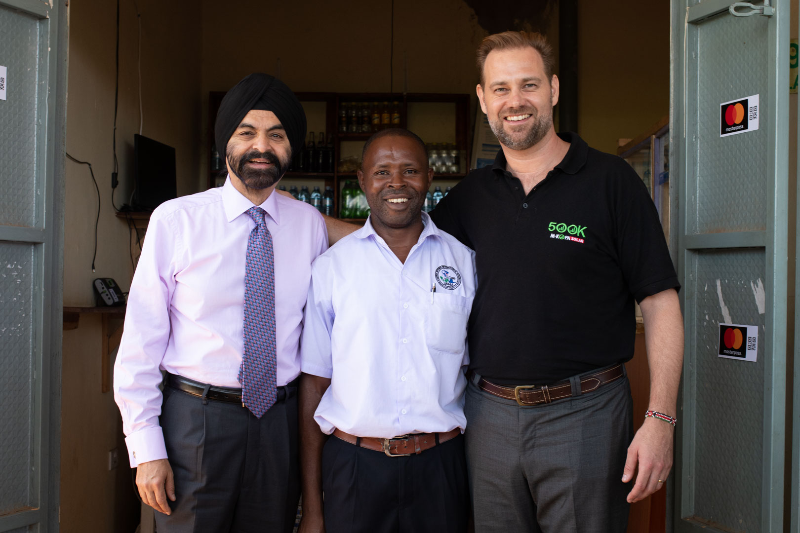 Ajay Banga, Jesse Moore and small shop owner
