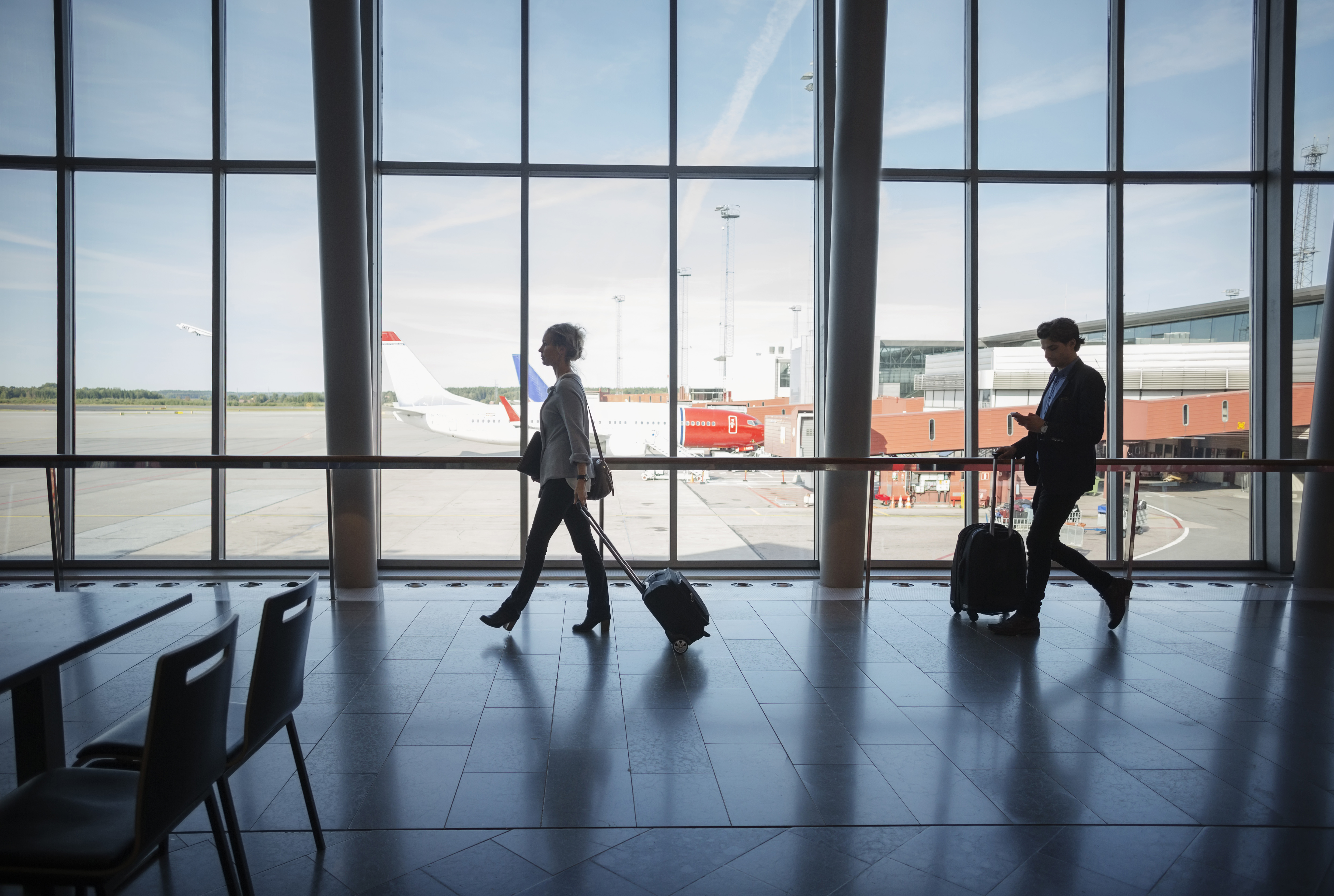 Traveling partner. Люди в бизнес джете. Aeroport stock photo. The Luggage Side view. People with Luggage are waiting near the Airport Terminal photo.